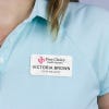 White name tag - data analyst - worn on a light polo for perspective