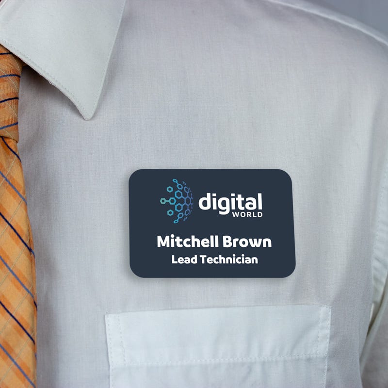 dark blue full-color name tag - lead technician - worn on a light blue dress shirt for size perspective