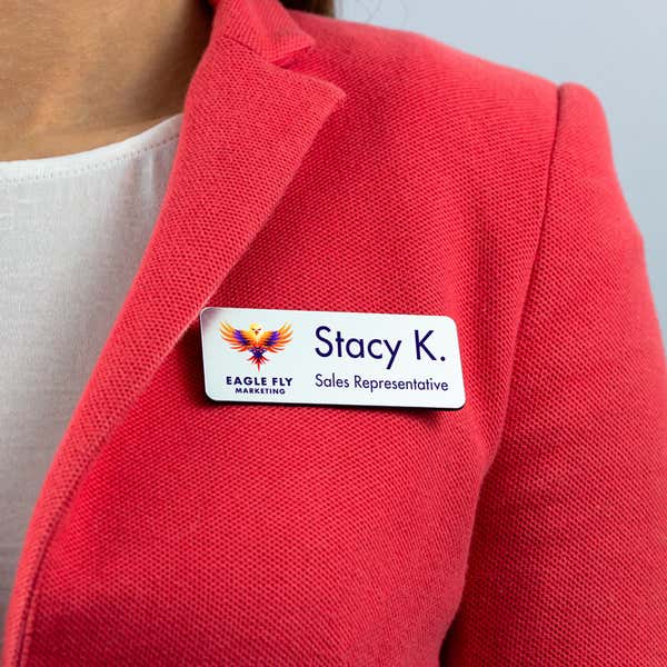 Example name tag - sales representative - worn on a pink blazer