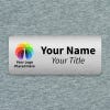 Brushed silver 1.25x3 inch name tag - sample template on a textured background