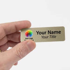 Hand holding 1" x 3" Gold Name Tag 