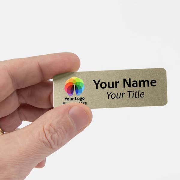 Hand holding 1" x 3" Gold Name Tag 