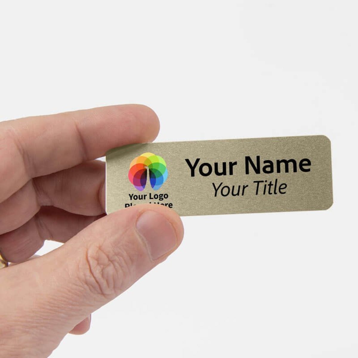 Hand holding 1" x 3" Gold Name Tag 