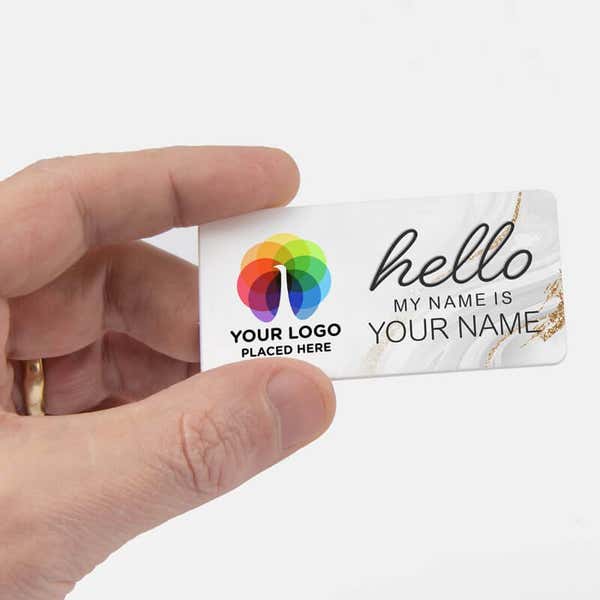 Hand holding a 1.5" x 3" UV Printed Full Color Upload Your Logo Hello My Name Is Name Tag