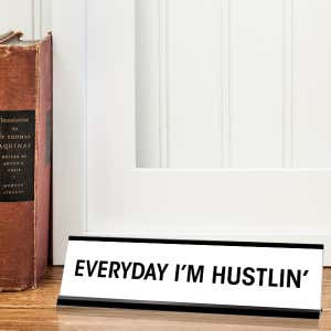 White desk plate with black custom text in black holder