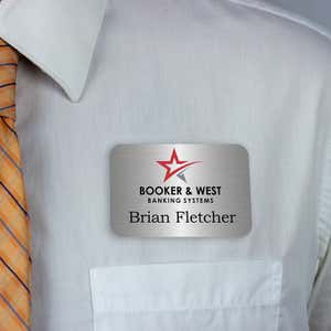 Dark blue full-color name tag - lead technician - worn on a light dress shirt for size perspective