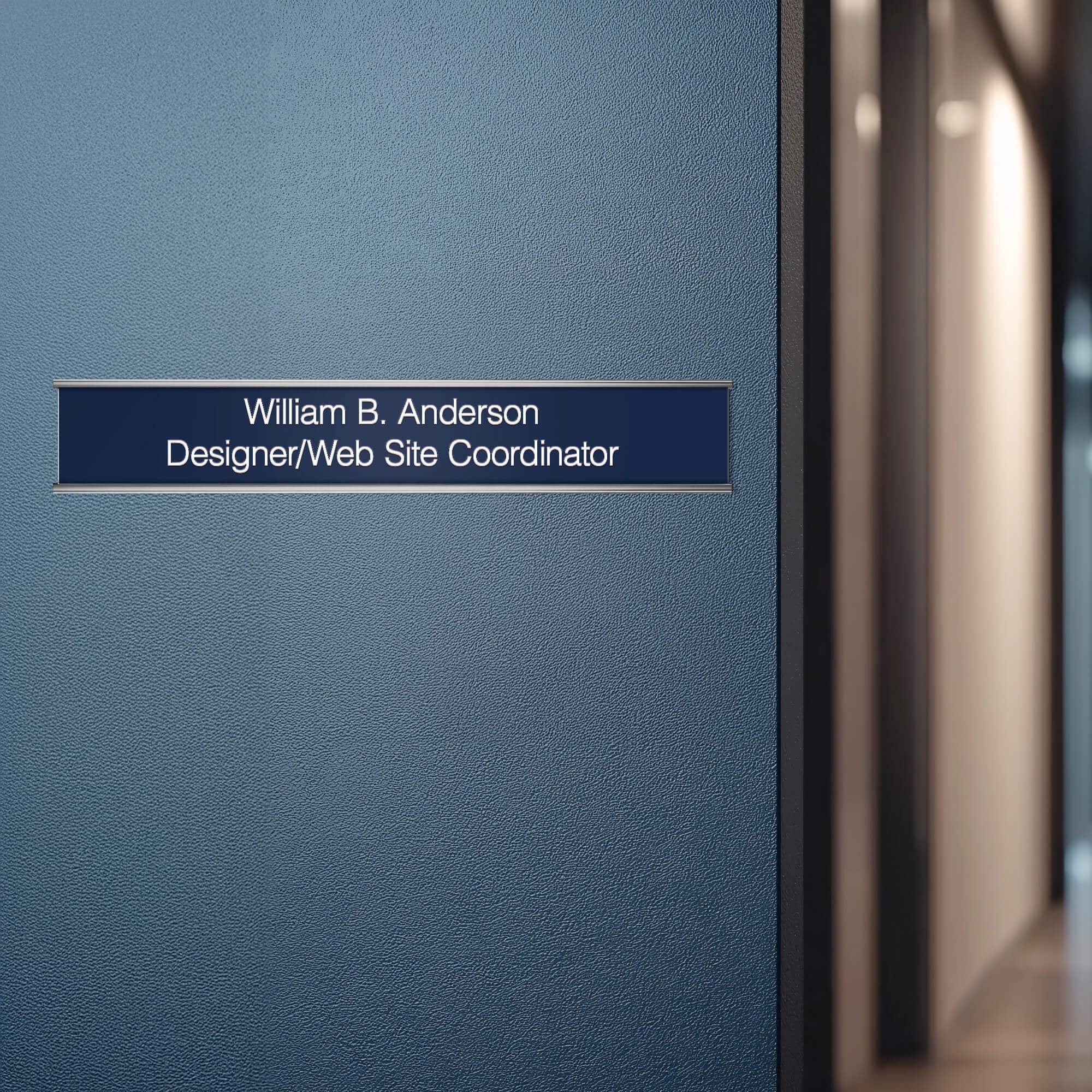A blue name plate with a silver aluminum wall holder on an office door A blue name plate with a silver aluminum wall holder on an office door
