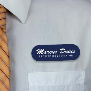 Engraved Plastic Custom Name Tag in Brushed Script Font on White Shirt with Orange Tie