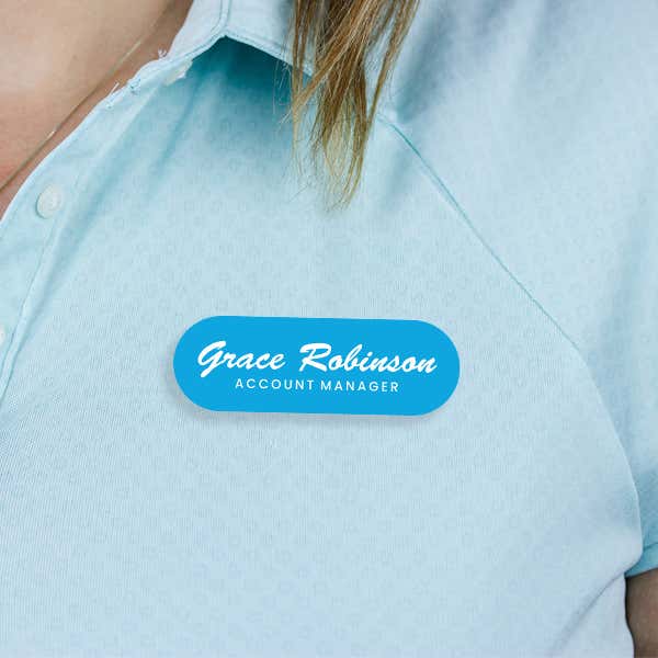 Engraved Plastic Custom Name Tag in Brushed Script Font on Blue Polo Shirt