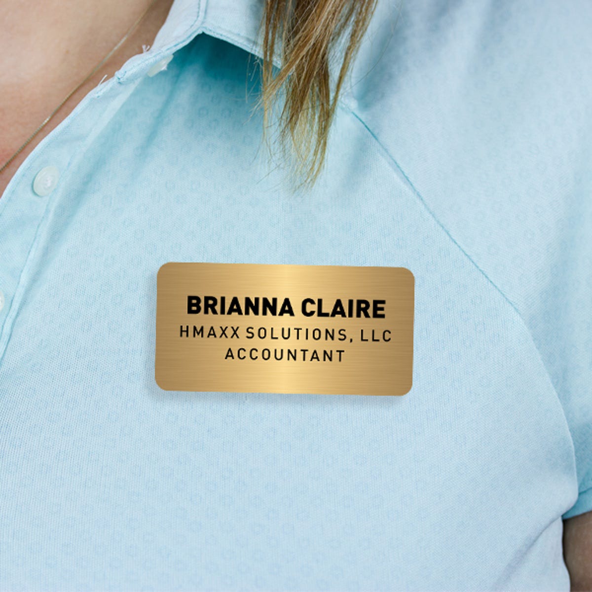 Engraved Plastic Custom Name Tag with 3 Lines of Custom Text on Blue Polo Shirt