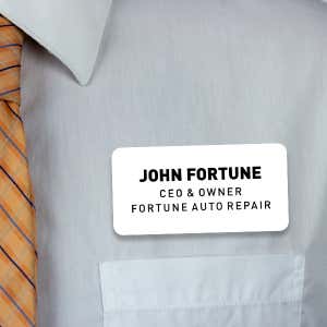 Engraved Plastic Custom Name Tag with 3 Lines of Custom Text on White Shirt with Orange Tie