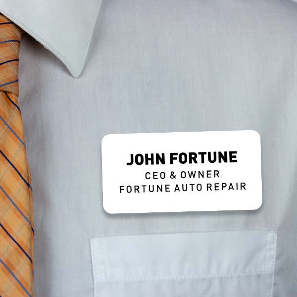 Engraved Plastic Custom Name Tag with 3 Lines of Custom Text on White Shirt with Orange Tie