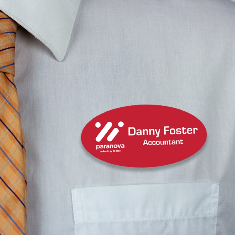 Engraved Plastic Custom Oval Name Tag with Oval Border on White Shirt with Orange Tie