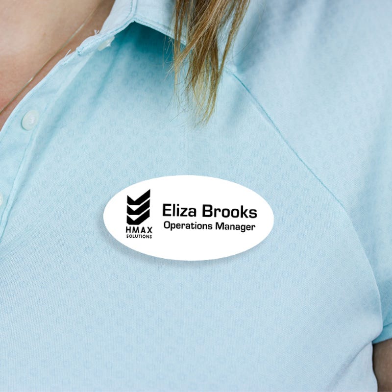Engraved Plastic Custom Oval Name Tag with Oval Border on Blue Polo Shirt