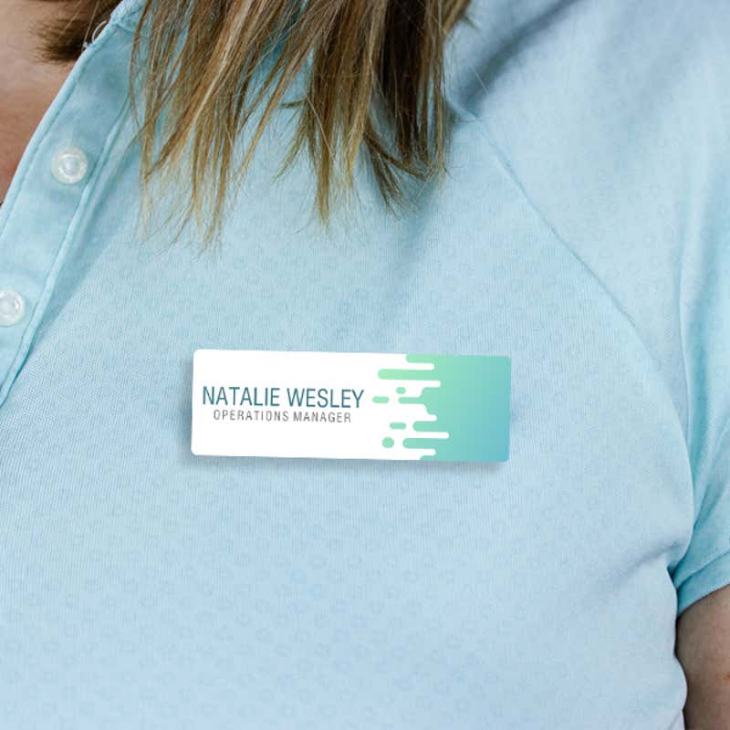 1" x 3" UV Printed Full Color Name Tag with Wave Pattern and Bold Condensed Custom Text on Blue Polo Shirt