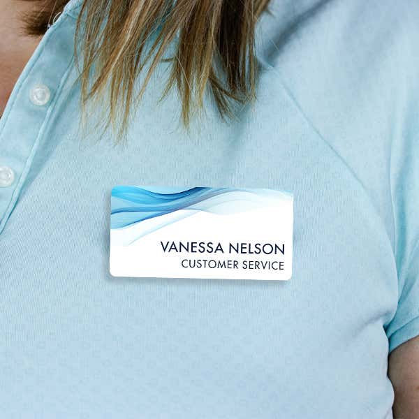1.5" x 3" UV Printed Full Color Name Tag on Corporate Blue Wave Background on Blue Polo Shirt