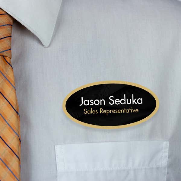 1.5" x 3" UV Printed Full Color Oval Name Tag on Corporate Black Background with Gold Outline on White Shirt with Tie