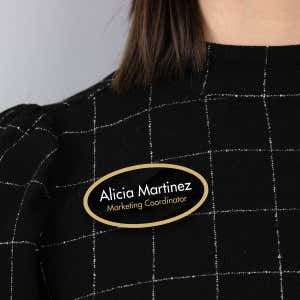 1.5" x 3" UV Printed Full Color Oval Name Tag on Corporate Black Background with Gold Outline on Black Blouse