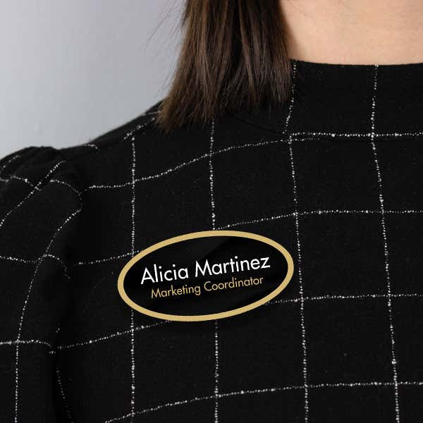 1.5" x 3" UV Printed Full Color Oval Name Tag on Corporate Black Background with Gold Outline on Black Blouse
